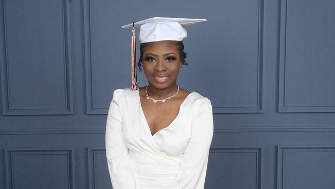 Camajah Moore-Harris wearing graduation gown.