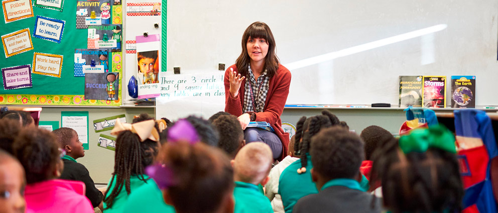 Teacher helping student