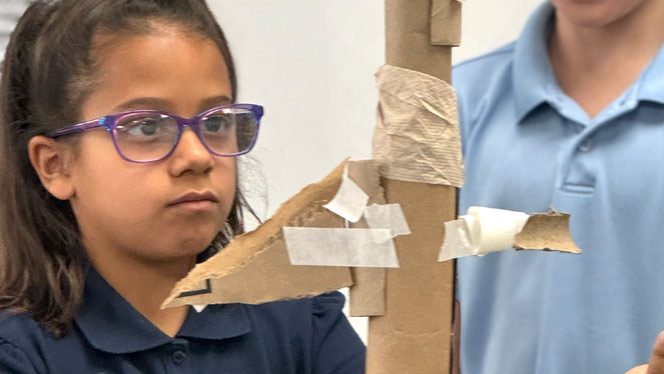 Student building their structure.