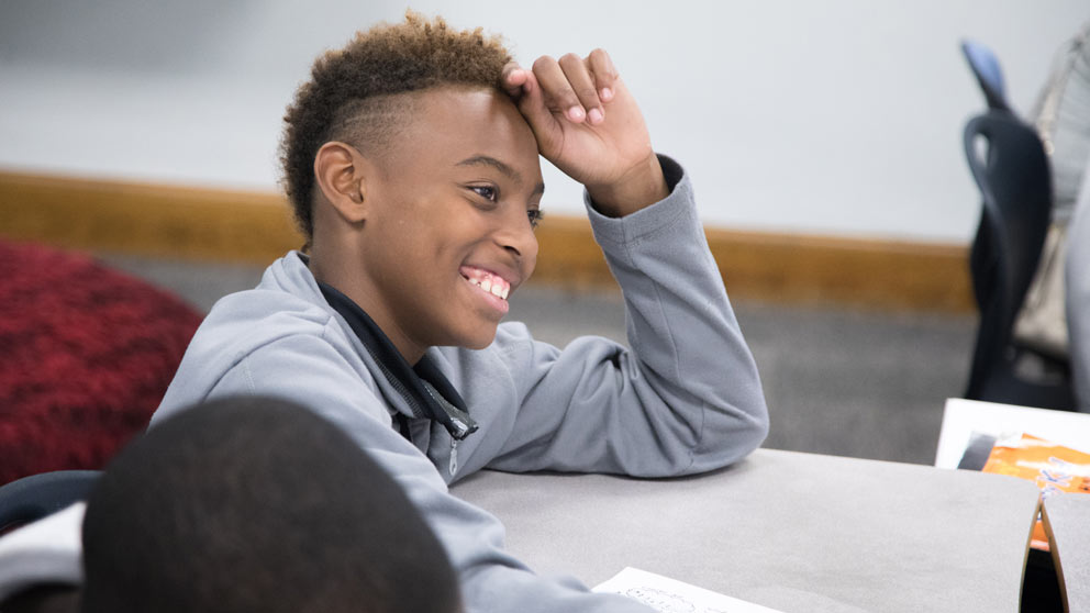 Teacher helping student