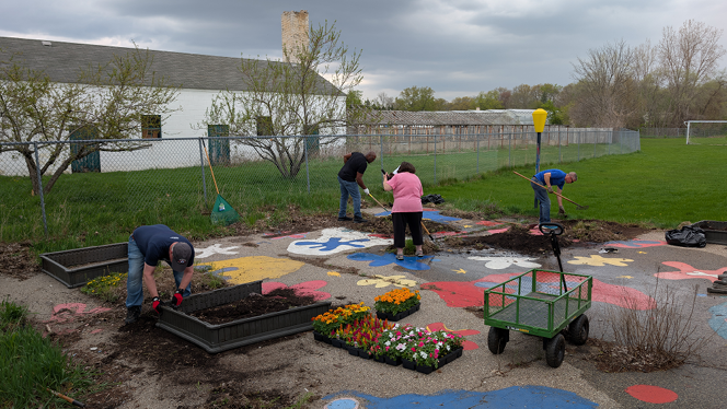 K-12 Schools in Grand Rapids: NHA Service Center employees volunteer at two local NHA schools for Earth Day.