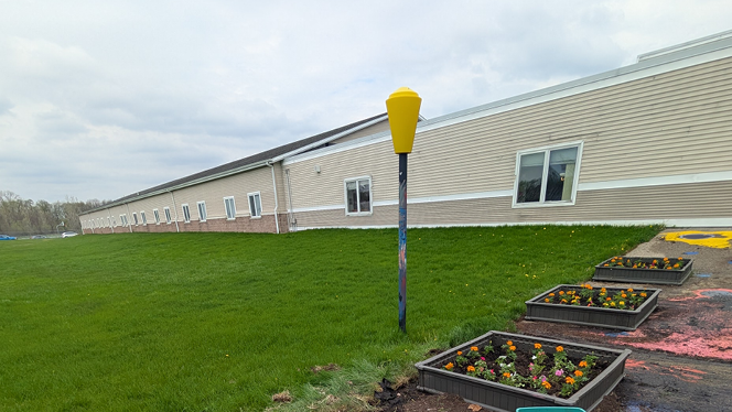 K-12 Schools in Grand Rapids: NHA Service Center employees volunteer at two local NHA schools for Earth Day.