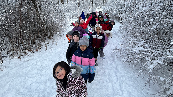 Students on snowy trail.