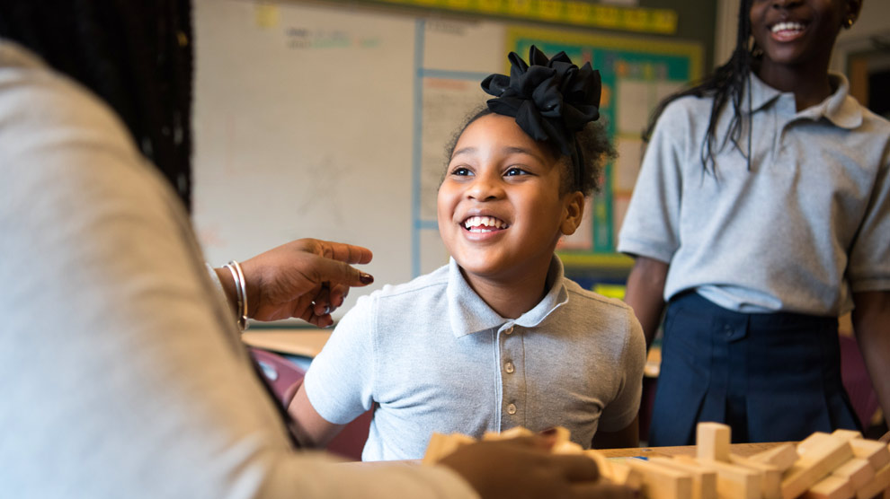 Two students smiling