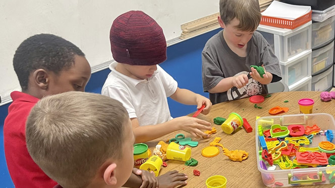 Students playing with Play Doh