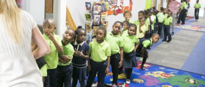 K-8 School in Detroit: Students lined up in hallway.