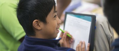 Student completing work in classroom