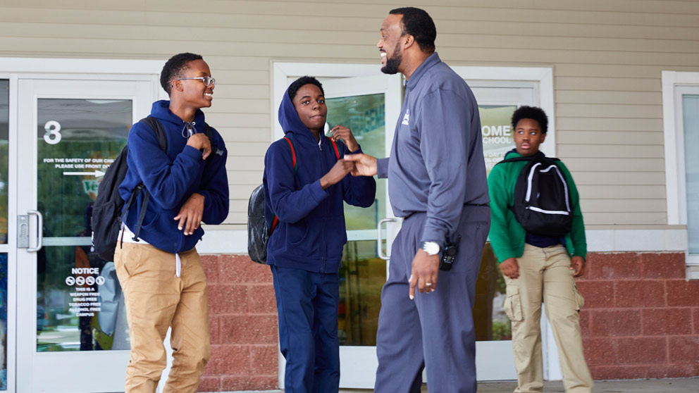 Teacher helping student