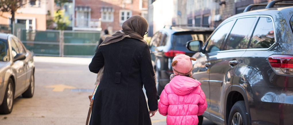 Parent walking with child to car