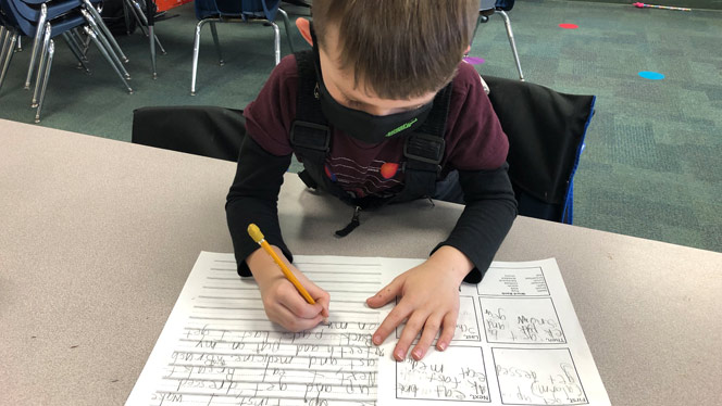 Eagle Crest student practicing writing