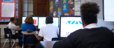 K-8 School in Dayton: Students doing activity on computers in computer class.