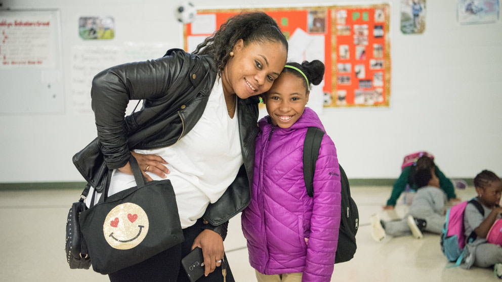 Parents picking up students outside of school at the end of the day