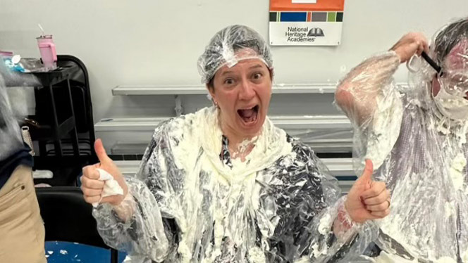 Teacher posing after getting pied