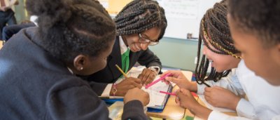 Students completing work in classroom