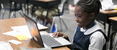 Student completing work in classroom