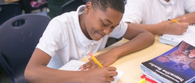 K-8 School in Ypsilanti: Student working on worksheet.
