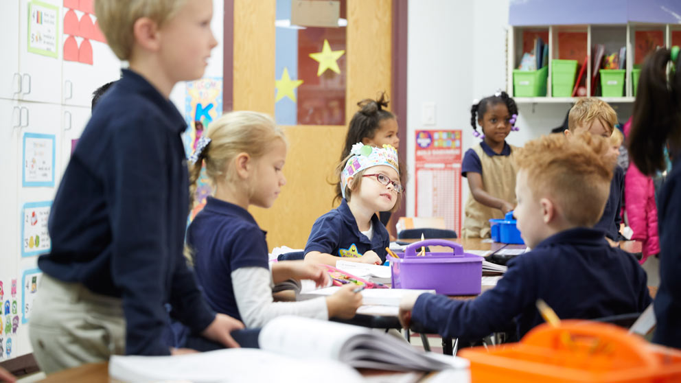 Teacher helping student