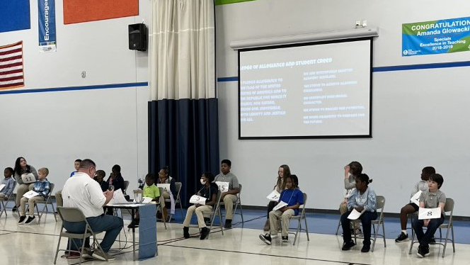 Students participating in spelling bee.