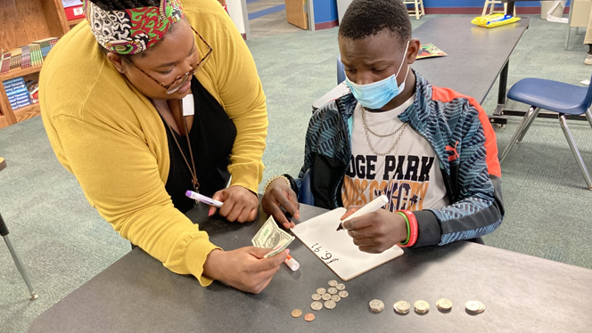 Christina Spencer and Valentino working on a money problem.