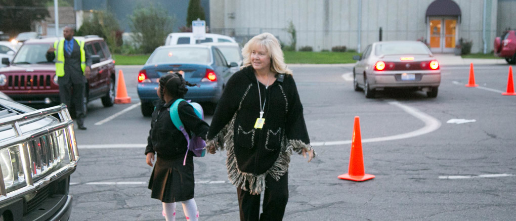 Student walking with faculty member