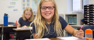 Student completing work in classroom