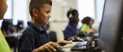 Student completing work in classroom