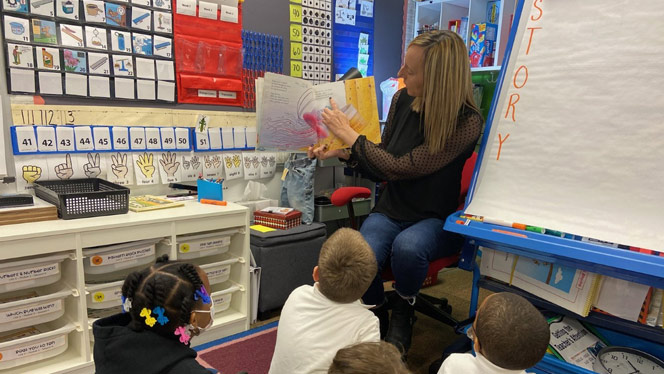 teacher reading to her students