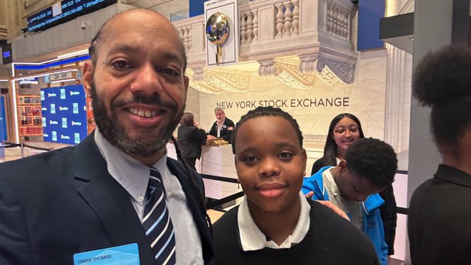 Principal with student at NYSE