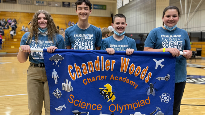 Chandler Woods students holding banner