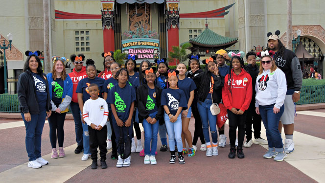 Group picture of students and staff at Disney.