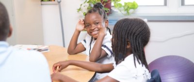 Student smiling in classroom