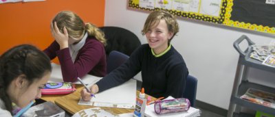 K-8 School in Canton: Students working on an assignment at their desk.
