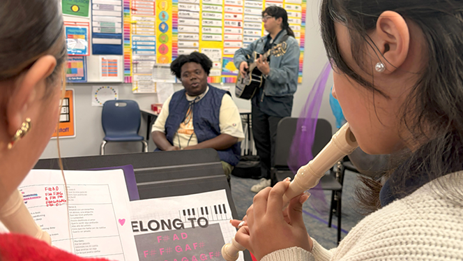 K-6 School in Commerce City: Capstone Academy music students welcomed members of a local band to sit with them during their rehearsal.