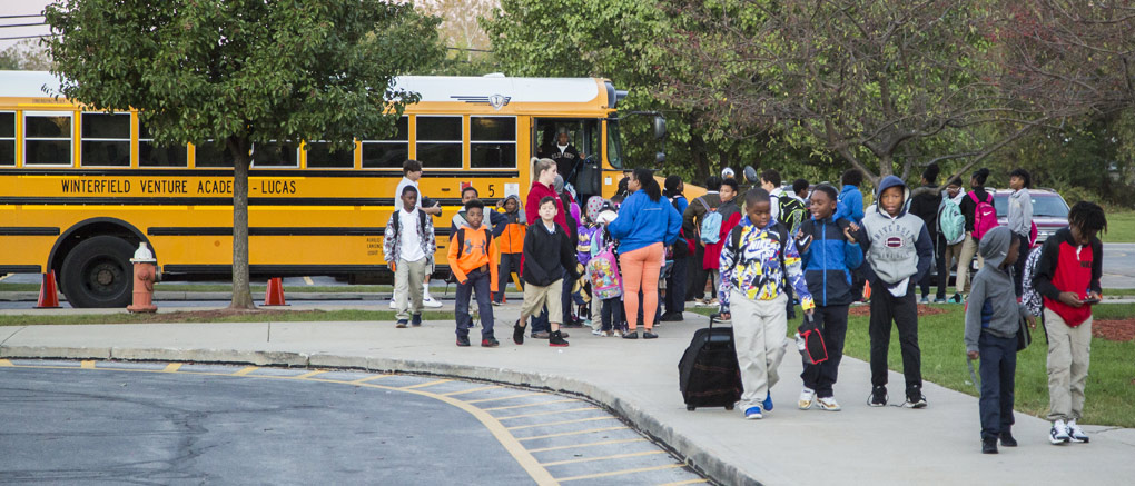 Students getting off bus