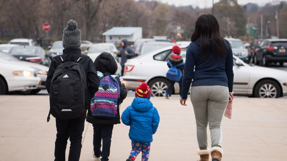 Teacher helping student