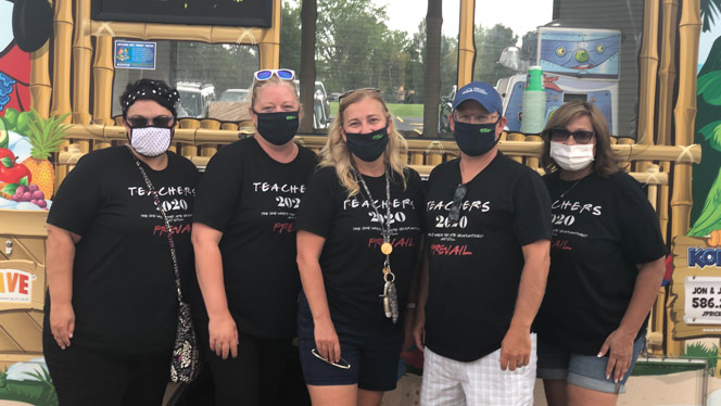 Teachers smiling for the camera