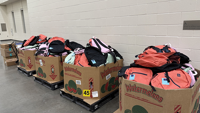 Charter Schools in Grand Rapids: National Heritage Academies partnered with In The Image Shoes Event to provide a pair of shoes to students.