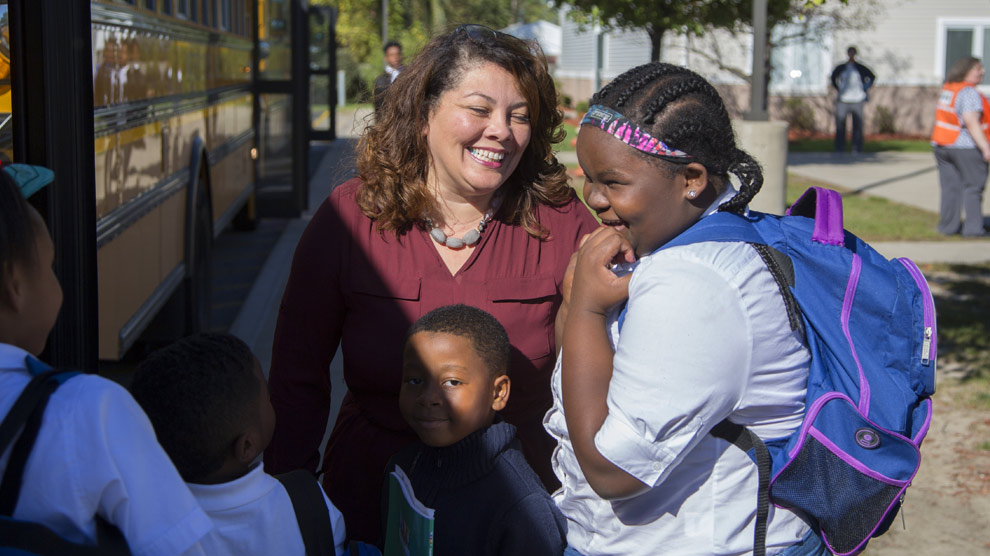Teacher helping student
