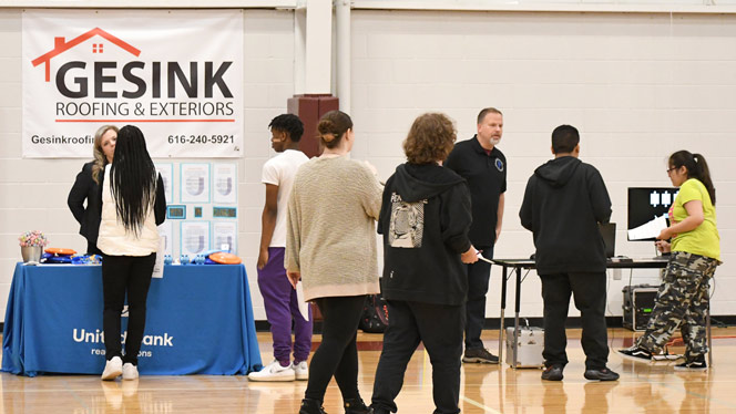 Wellspring Prep students walking around career fair.