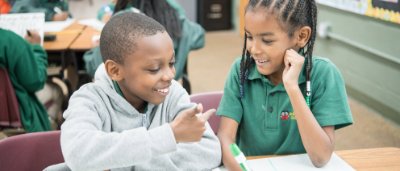 Brooklyn Scholars Charter School, K-8 School in Brooklyn, NY: students counting on their fingers.