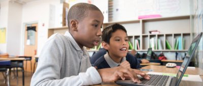 Brooklyn Dreams Charter School, K-8 School in Brooklyn, NY: two students working at computer together.