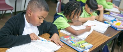 Students completing work in classroom