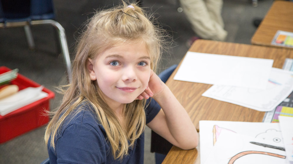 Girl studies in class