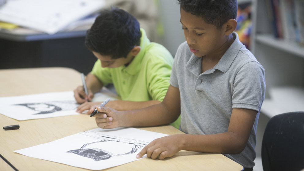 Student raising hand in class