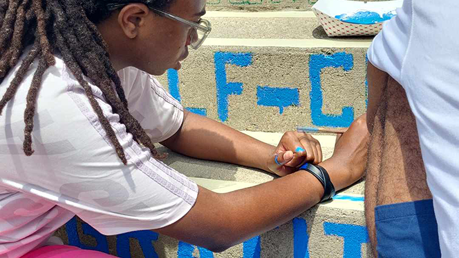 K-8 School in East Cleveland: Apex Academy Art Club and Art Teacher painted Moral Focus virtues on the school's back steps as part of a summer break project.