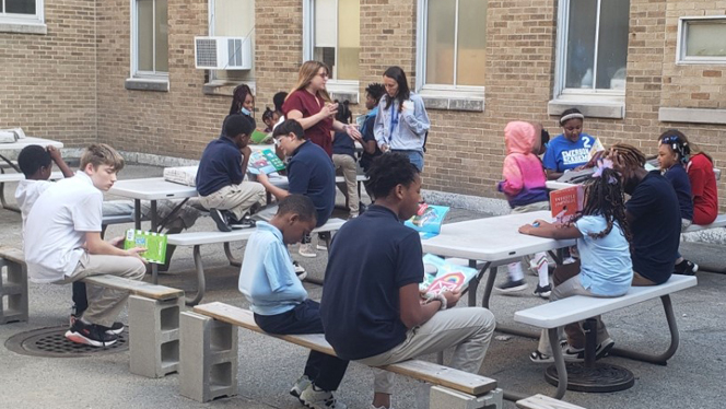Emerson Academy students reading outside