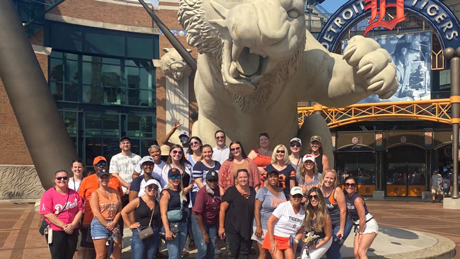 Group of people outside the Detroit Tigers game.