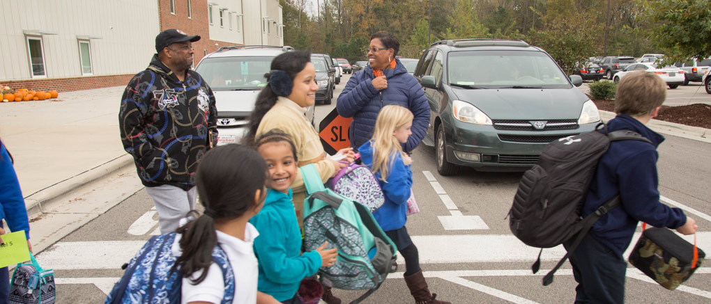 Parents and students in crosswalk