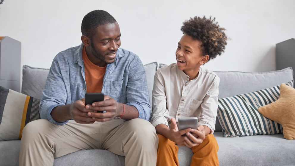 Teacher greeting student and parent