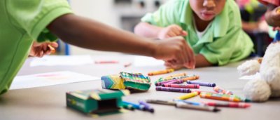 Advantage Charter Academy, K-8 Charter School in Baker, Louisiana: students looking at crayons in a classroom.